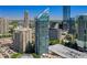 High-rise condo building featuring glass windows, balconies, and surrounding city views at 3338 Peachtree Ne Rd # 2701, Atlanta, GA 30326