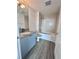 Well-lit bathroom featuring a granite-topped vanity, a tub, and modern fixtures at 3338 Peachtree Ne Rd # 2701, Atlanta, GA 30326