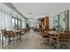 Open concept common area with tables and chairs with lots of natural light at 3338 Peachtree Ne Rd # 2701, Atlanta, GA 30326