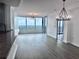 Bright living room featuring floor-to-ceiling windows with a stunning city view and modern light fixtures at 3338 Peachtree Ne Rd # 2701, Atlanta, GA 30326