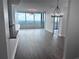 Spacious living room with hardwood floors, floor to ceiling windows, and modern light fixtures at 3338 Peachtree Ne Rd # 2701, Atlanta, GA 30326