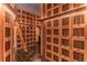Unique wine cellar with wooden storage compartments, rolling ladder, and constellation projection on ceiling at 3338 Peachtree Ne Rd # 2701, Atlanta, GA 30326