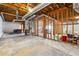 Unfinished basement with exposed beams, ductwork, and framed walls, offering a customizable space for future expansion and storage at 3395 Hunters Place, Stonecrest, GA 30038