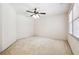 Bedroom featuring carpeted floors, a ceiling fan, and natural light at 3395 Hunters Place, Stonecrest, GA 30038