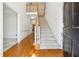 Bright foyer with hardwood floors and staircase leading to the second level at 3395 Hunters Place, Stonecrest, GA 30038