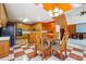 Eat-in kitchen with classic cabinets and adjacent living space at 3395 Hunters Place, Stonecrest, GA 30038