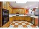 Kitchen with classic cabinets, double oven, and white countertops at 3395 Hunters Place, Stonecrest, GA 30038