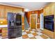 Bright kitchen with stainless steel appliances and patterned flooring at 3395 Hunters Place, Stonecrest, GA 30038