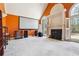 Spacious living room with large windows, a fireplace, and a projector screen at 3395 Hunters Place, Stonecrest, GA 30038