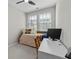 Cozy bedroom with a twin bed, desk, chair, carpet and a window for natural light at 6023 Skellig St, Norcross, GA 30071