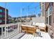 Outdoor deck with comfortable seating, string lights, and a view of the neighborhood at 6023 Skellig St, Norcross, GA 30071