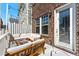 Outdoor deck with cozy seating, string lights, and privacy fencing at 6023 Skellig St, Norcross, GA 30071