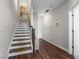 Inviting foyer with hardwood floors, a staircase, and neutral wall paint creates a welcoming atmosphere at 6023 Skellig St, Norcross, GA 30071