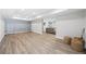 Finished basement area featuring hardwood style flooring and access to the main living area at 840 Stonehaven Ln, Alpharetta, GA 30005