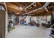Unfinished basement with exposed wood ceiling and lots of room for a workout or extra storage at 840 Stonehaven Ln, Alpharetta, GA 30005