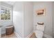 Half bathroom featuring neutral walls and a window at 840 Stonehaven Ln, Alpharetta, GA 30005