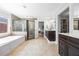 Spacious bathroom with a soaking tub, glass enclosed shower, and double sink vanity at 840 Stonehaven Ln, Alpharetta, GA 30005
