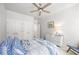 Bright bedroom featuring neutral walls, a ceiling fan, and a large closet at 840 Stonehaven Ln, Alpharetta, GA 30005