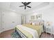 Bedroom with tray ceiling, neutral walls and a queen bed; two windows provide lots of light at 840 Stonehaven Ln, Alpharetta, GA 30005