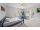 This bedroom is painted a neutral color and features a ceiling fan and adjoining bathroom at 840 Stonehaven Ln, Alpharetta, GA 30005