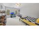 Bedroom featuring carpet, natural light from two windows, desk, and ceiling fan at 840 Stonehaven Ln, Alpharetta, GA 30005