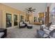Relaxing covered patio with ceiling fan, comfortable seating, and charming porch swing for outdoor enjoyment at 840 Stonehaven Ln, Alpharetta, GA 30005