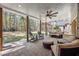 Inviting covered patio featuring comfortable seating and views of the expansive backyard and lush greenery at 840 Stonehaven Ln, Alpharetta, GA 30005