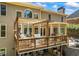 Spacious deck with pergola, comfortable seating, and outdoor dining area overlooking the backyard at 840 Stonehaven Ln, Alpharetta, GA 30005