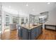 A kitchen island featuring granite countertops, a sink, and stainless steel appliances at 840 Stonehaven Ln, Alpharetta, GA 30005
