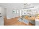 Spacious main bedroom with tray ceilings, fireplace, and hardwood floors at 840 Stonehaven Ln, Alpharetta, GA 30005