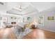 Spacious main bedroom with tray ceilings, fireplace, and hardwood floors at 840 Stonehaven Ln, Alpharetta, GA 30005