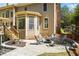 Charming outdoor patio with stone pavers, seating area, and view of the backyard at 840 Stonehaven Ln, Alpharetta, GA 30005