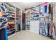 Spacious walk-in closet with custom shelving and ample storage space for clothes, shoes, and accessories at 840 Stonehaven Ln, Alpharetta, GA 30005