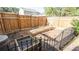 Backyard with wooden fence, raised garden beds, and greenery, creating a serene outdoor space at 1924 Sweet Flag Rd, Lawrenceville, GA 30045