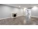 Spacious basement featuring an electric fireplace and sliding glass door for a versatile layout at 1924 Sweet Flag Rd, Lawrenceville, GA 30045
