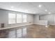 Finished basement with three windows, drop ceiling, offering ample natural light, and a sleek floor at 1924 Sweet Flag Rd, Lawrenceville, GA 30045