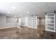 Bright basement with sliding glass doors, recessed lighting, and sleek flooring, ideal for entertainment at 1924 Sweet Flag Rd, Lawrenceville, GA 30045