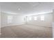Expansive bonus room with neutral carpet, bright, natural light, and plenty of room to spread out at 1924 Sweet Flag Rd, Lawrenceville, GA 30045