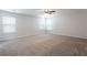Spacious bonus room with neutral carpet and bright, natural light, offering lots of possibilities at 1924 Sweet Flag Rd, Lawrenceville, GA 30045