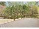 Expansive wooden deck overlooking lush greenery and mature trees providing privacy at 1924 Sweet Flag Rd, Lawrenceville, GA 30045