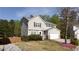 Inviting two-story home featuring a manicured lawn, two-car garage, and welcoming entrance at 1924 Sweet Flag Rd, Lawrenceville, GA 30045