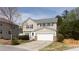 Charming two-story home with a well-manicured lawn and a two-car garage at 1924 Sweet Flag Rd, Lawrenceville, GA 30045