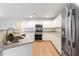 Kitchen features stainless steel appliances, granite countertops, and recessed lighting at 1924 Sweet Flag Rd, Lawrenceville, GA 30045
