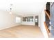 Bright living room with neutral walls, light wood floors, staircase and plenty of natural light at 1924 Sweet Flag Rd, Lawrenceville, GA 30045