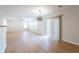 Bright open living area with light wood floors, large windows, and a sliding glass door leading to outdoor space at 1924 Sweet Flag Rd, Lawrenceville, GA 30045