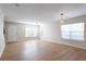 Bright living room featuring light wood floors, large windows for natural light, and neutral wall colors at 1924 Sweet Flag Rd, Lawrenceville, GA 30045