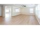 Spacious living area with neutral walls, light wood flooring, and a ceiling fan for a modern feel at 1924 Sweet Flag Rd, Lawrenceville, GA 30045