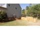 Exterior side yard shows lush lawn with privacy fence at 1924 Sweet Flag Rd, Lawrenceville, GA 30045