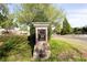 Community sign for Swim & Tennis within a lushly landscaped neighborhood at 1924 Sweet Flag Rd, Lawrenceville, GA 30045