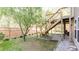 Wooden staircase leading to a deck with metal railing and a backyard view at 1924 Sweet Flag Rd, Lawrenceville, GA 30045
